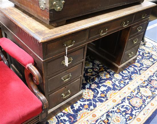 A late Victorian oak pedestal desk W.136cm